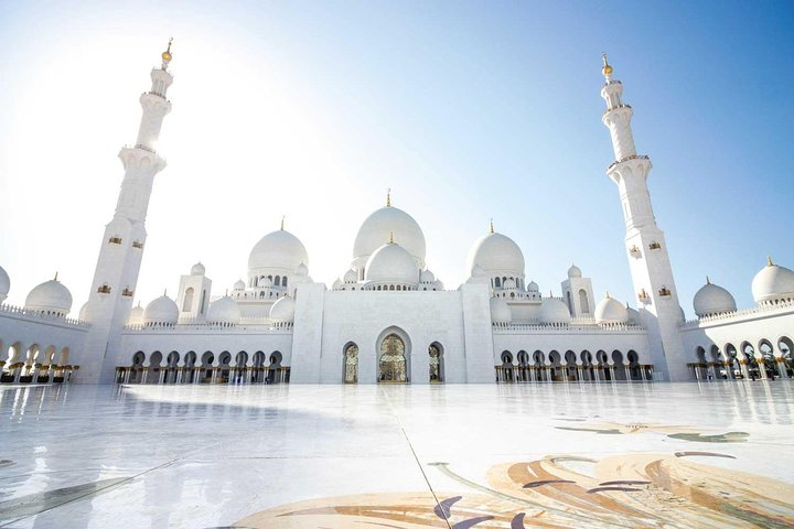 Discover the stunning architecture of Abu Dhabi's grand mosque where intricate designs and serene surroundings invite exploration making it a must-visit on your journey through the UAE.